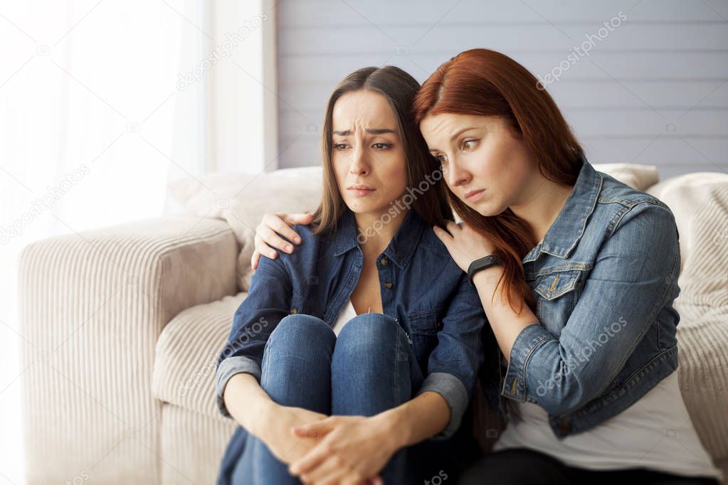 Woman  Comforting Unhappy Friend