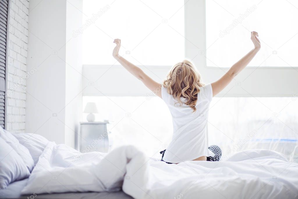 young woman waking up