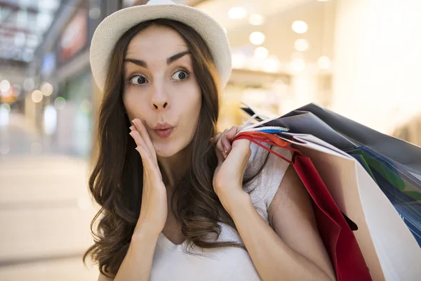 Happy woman with shopping bags