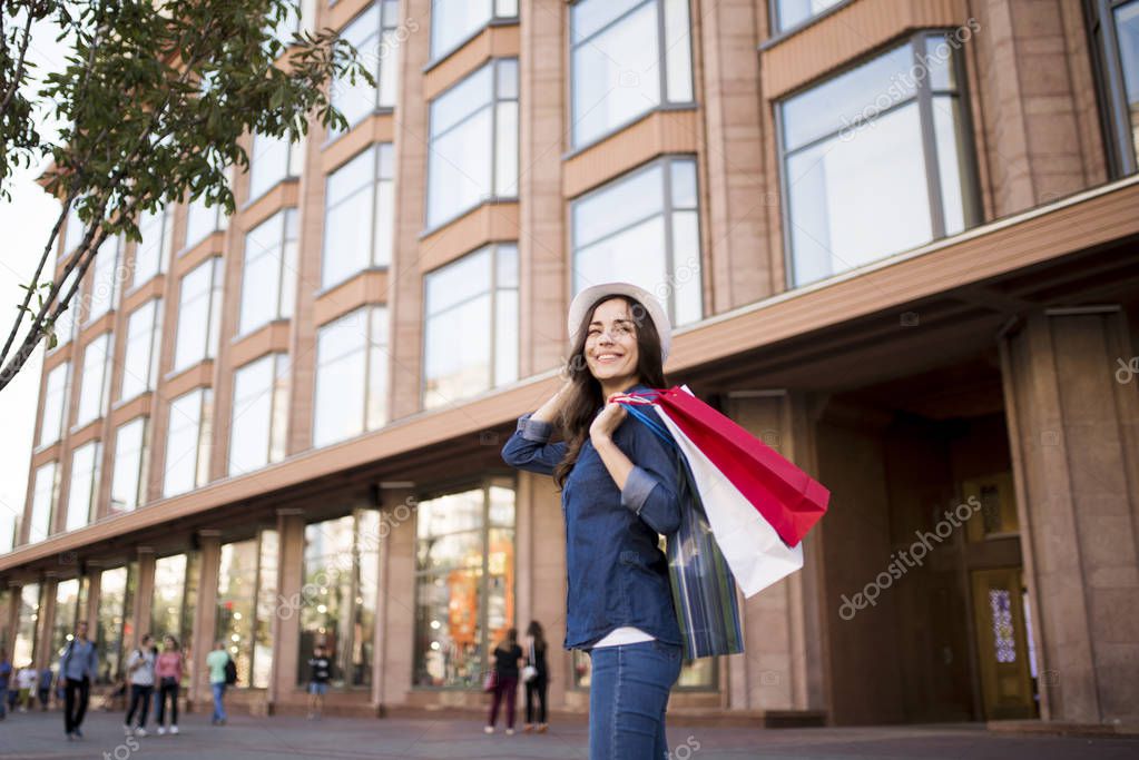 Happy woman with shopping bags