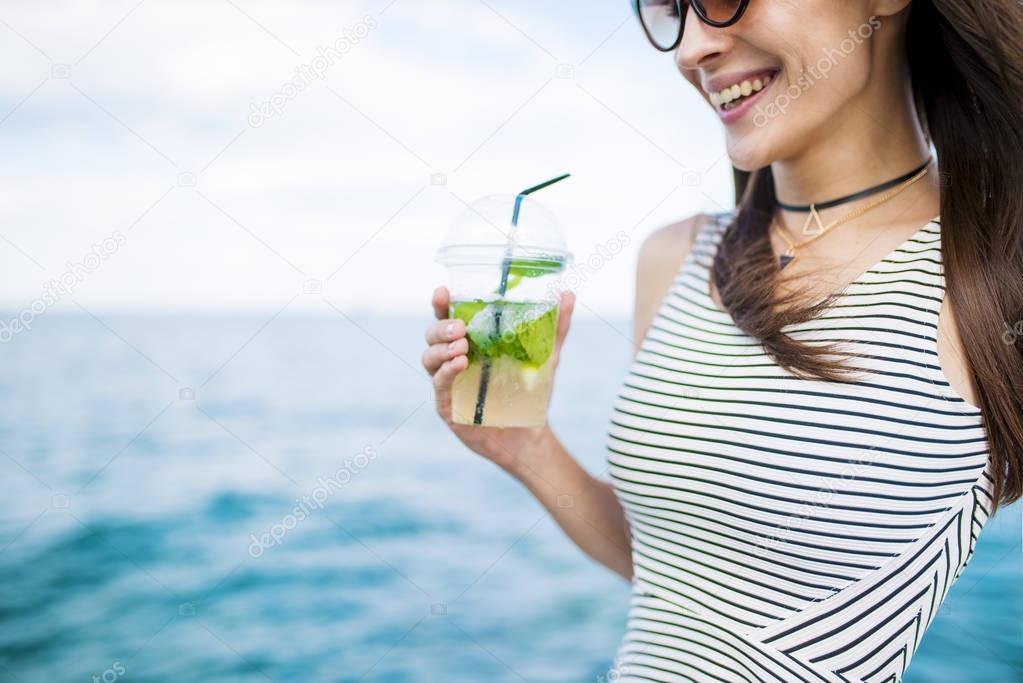 beautiful young woman with mojito