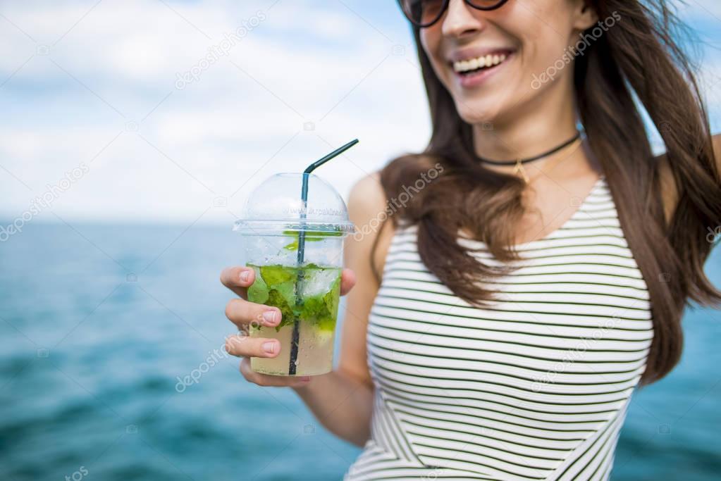 beautiful young woman with mojito