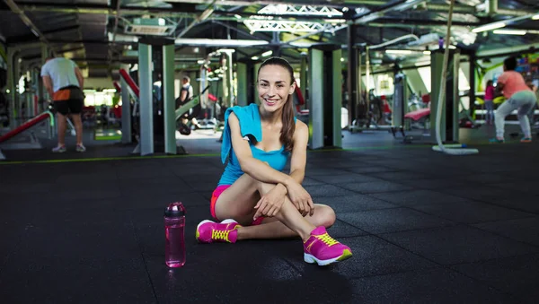 Woman with water after training — Stock Photo, Image