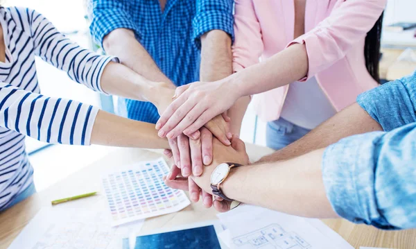 Businesspeople putting hands together — Stock Photo, Image