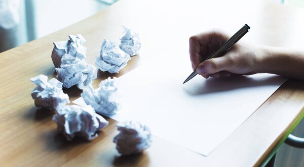 hand write something on paper 