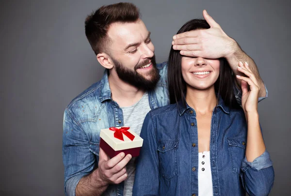 Gift Second Young Man Gives His Beloved Present Closes Her — Stock Photo, Image