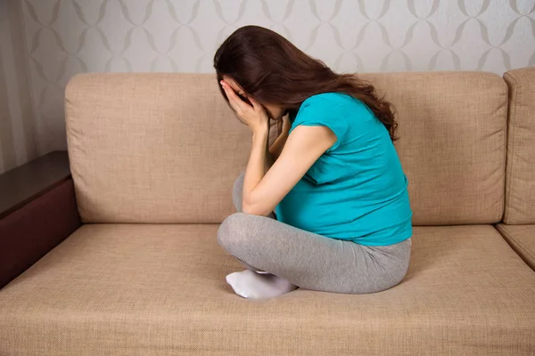 Upset Young Pregnant Woman Sitting Couch Home Cries Side View — Stock Photo, Image