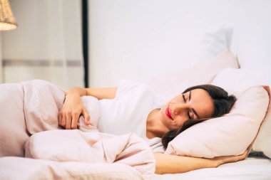young beautiful woman in bedroom   sleeping 