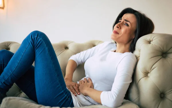 Abdominal Pain Young Brunette Woman Lying Couch Crying While Holding — Stock Photo, Image