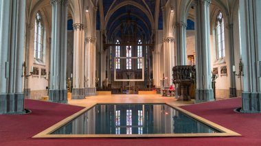 Interior pool of Church of St Magdalene in the city of Bruges, Belgium clipart