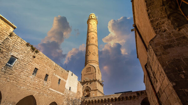 Mardin, Turkey - January 2020: Ulu Cami, also known as Great mosque of Mardin with single minaret in Mardin cityscape