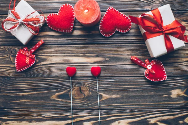 Red hearts, gifts and candle — Stock Photo, Image