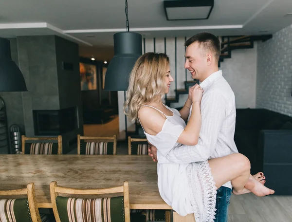 Beautiful couple in kitchen — Stock Photo, Image