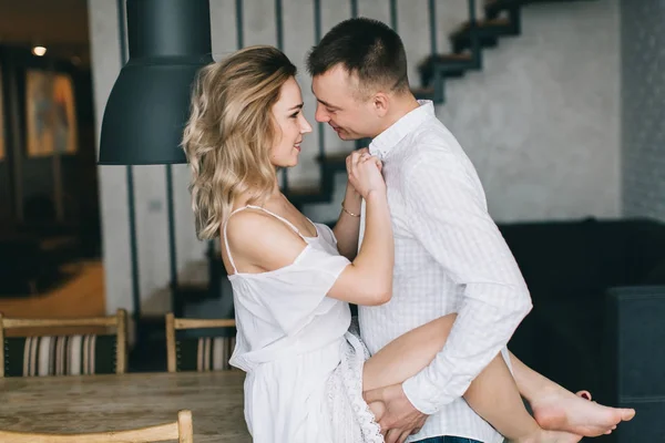 Beautiful couple in kitchen — Stock Photo, Image