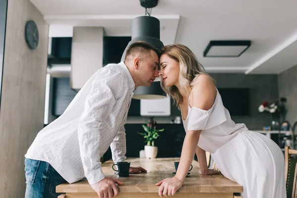 Beautiful couple in kitchen — Stock Photo, Image
