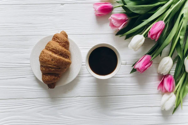 tulips with coffee and croissant
