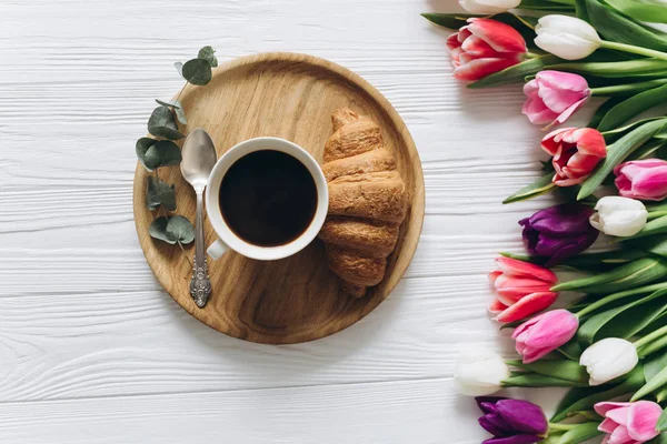 beautiful tulips with coffee cup