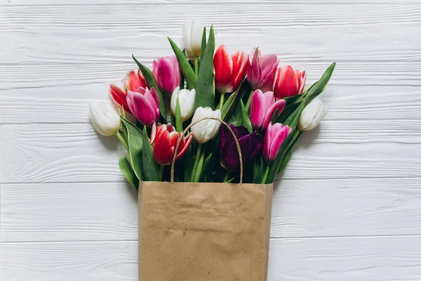 tulips flowers in shopping bag