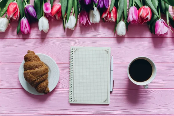 tulips with coffee and Notepad