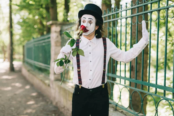 mime artist with red rose