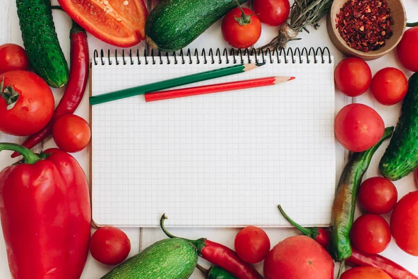 Notebook with vegetables and spices — Stock Photo, Image