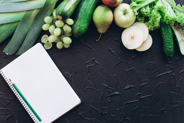 Notebook with vegetables and fruits