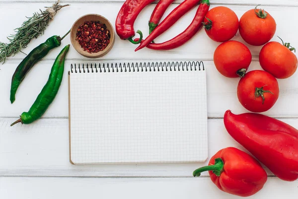 Notebook with vegetables and spices — Stock Photo, Image