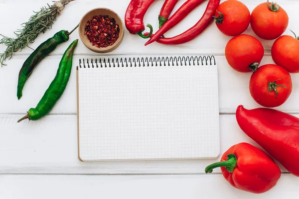 Notebook with vegetables and spices — Stock Photo, Image