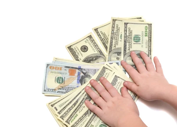 Ein Stapel Hundert-Dollar-Scheine auf weißem Hintergrund mit Kinderhänden — Stockfoto
