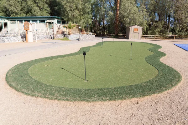 Golf hole in putting green. putting green is a mini golf course — Stock Photo, Image