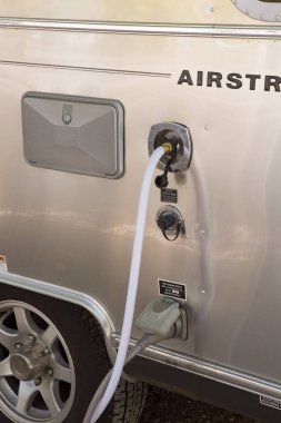  filling the water tank of a campervan clipart