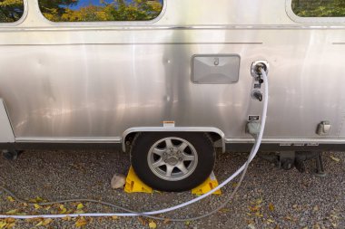  filling the water tank of a campervan clipart