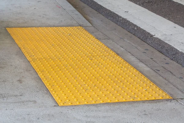 Tactile paving with textured ground surface with markings, indic — Stock Photo, Image