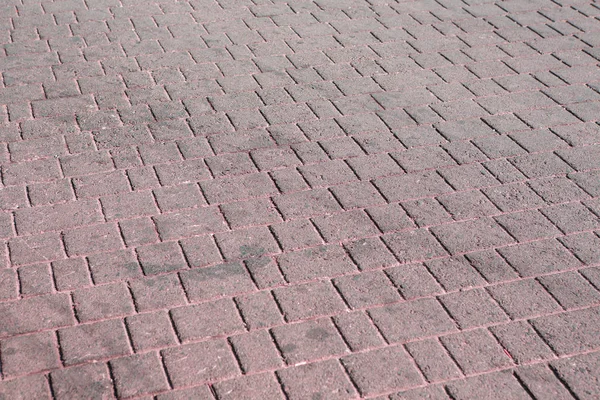 Brick paving stones on a sidewalk background texture — Stock Photo, Image