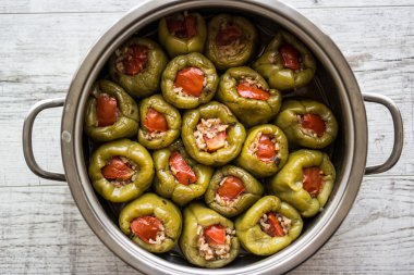 Biber Dolmasi / Turkish Stuffed Peppers in a pan.  clipart