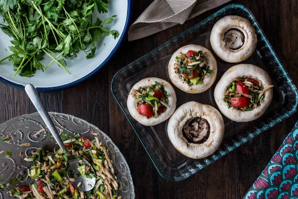 Mushrooms stuffed with vegetables before cooking. Stock Picture