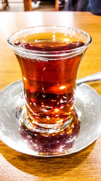 Traditional Turkish Tea on wooden surface at restaurant. — Stock Photo, Image