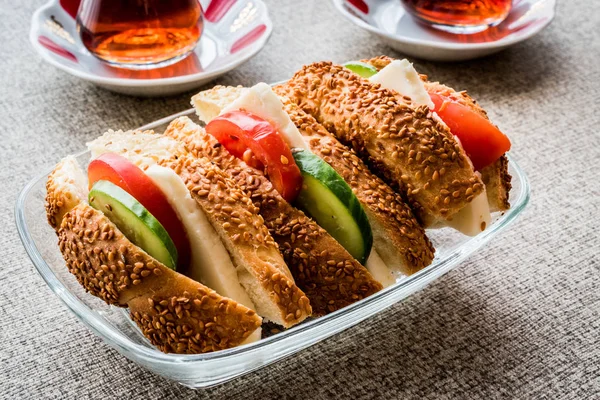 Turkish Bagel Simit Sandwich with cheese, tomato, cucumber and tea — Stock Photo, Image