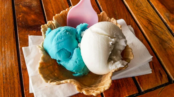 Vanilla and italian (blue) caramel ice cream in cone. — Stock Photo, Image