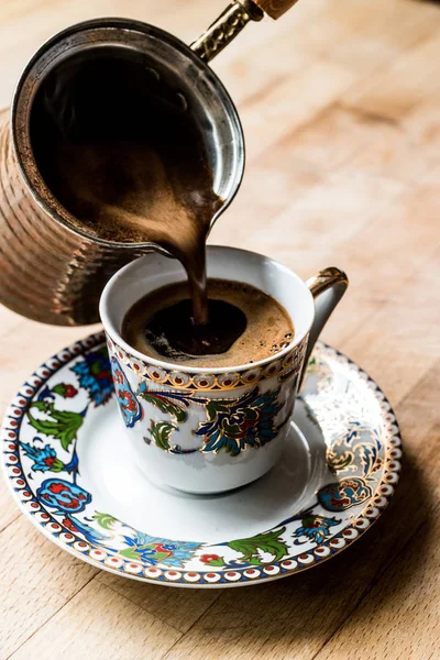 Pouring Turkish Coffee into the cup. — Stock Photo, Image