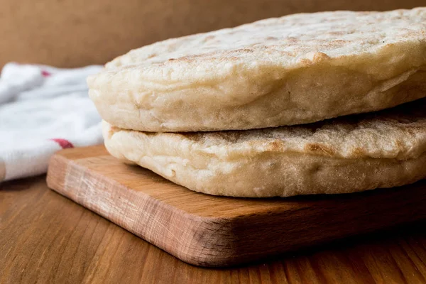 Turkish Bread Bazlama on wooden surface. — Stock Photo, Image