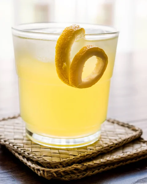 Yellow Bird Cocktail with lemon.