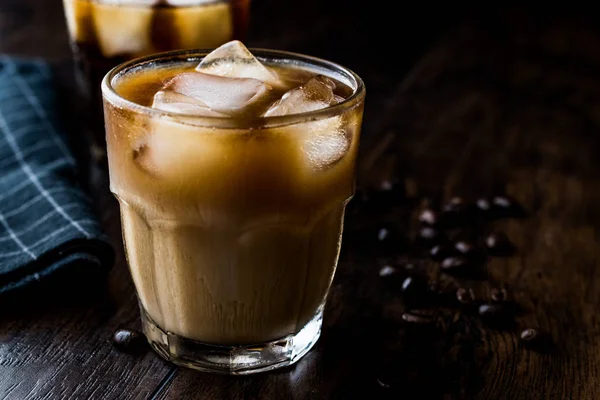 Cold brew coffee with milk and ice. (iced coffee)