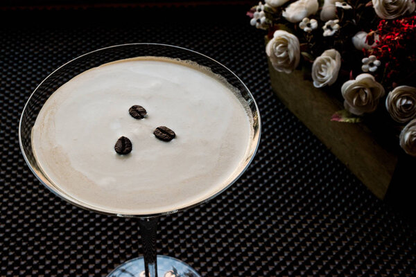 Espresso Martini Cocktail with coffee beans.