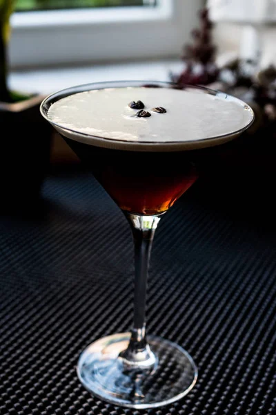 Espresso Martini Cocktail with coffee beans.