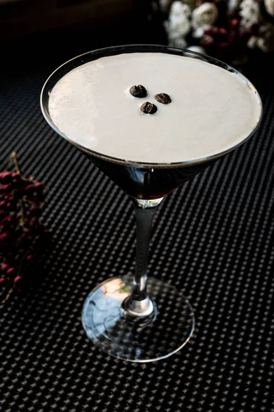 Espresso Martini Cocktail with coffee beans.