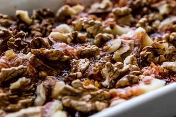 Figs with hazelnuts in a white tray. — Stock Photo, Image