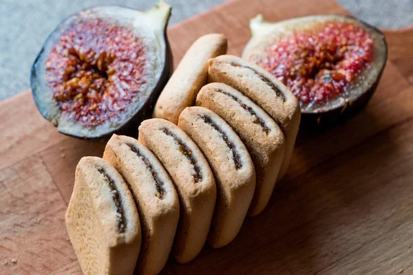 Fig Cookies with fruits on wooden surface. — Stock Photo, Image