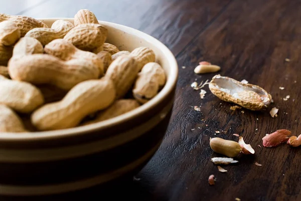 Bowl of Dry Salted Roasted Peanuts in Shell.