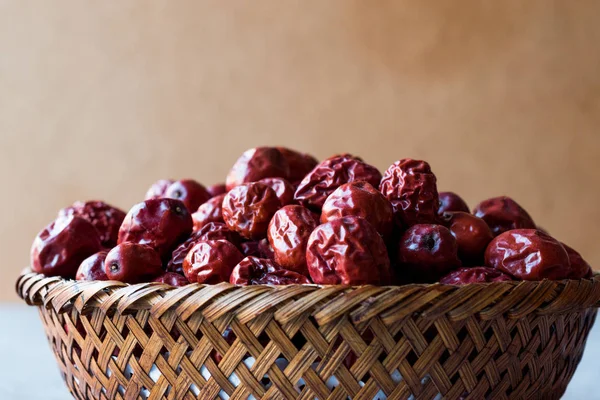 Red Jujube Fruits in Wooden Basket.
